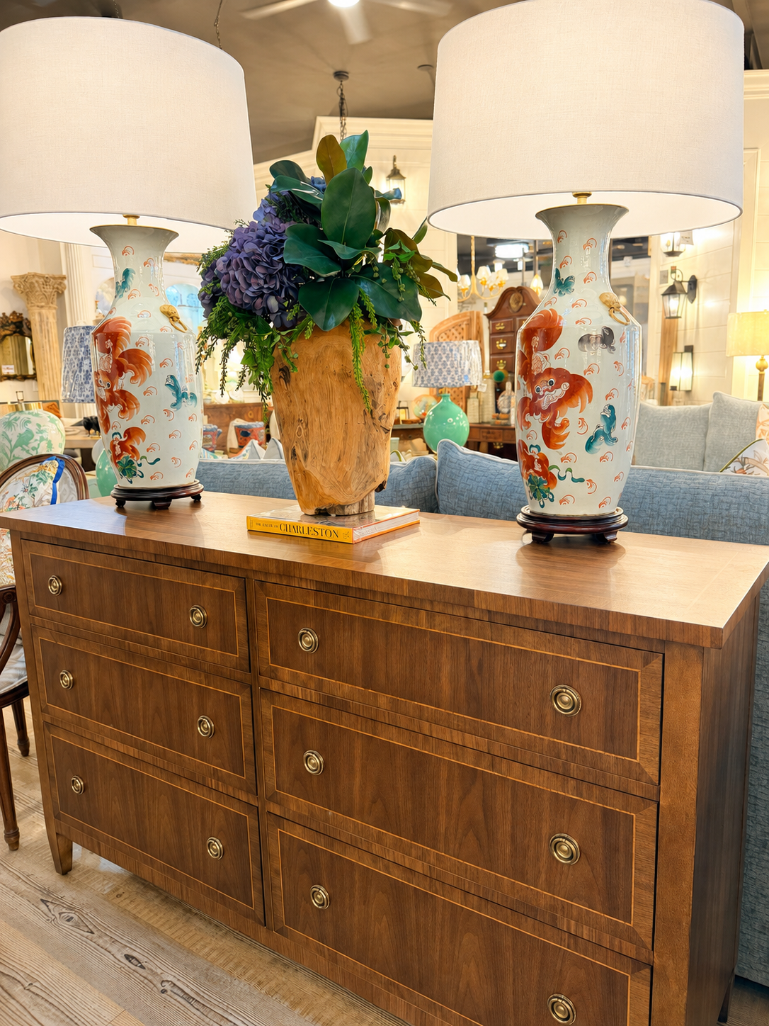 Inlaid walnut chest styled with porcelain lamps at Fifth Street Interiors